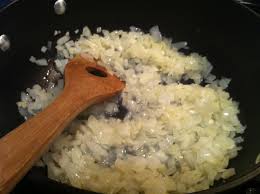 dicing onions in a skillet