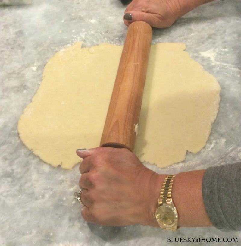 rolling out dough for apple crostata
