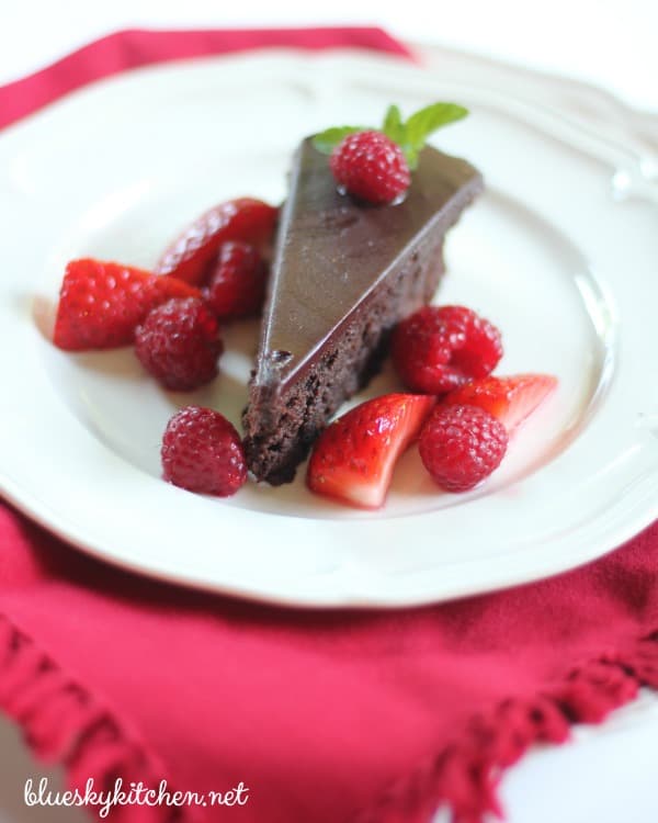 Chocolate Cassis Cake is Perfect for a Special Occasion. Creme de cassis adds a festive touch to this rich, flourless chocolate cake garnished with berries.
