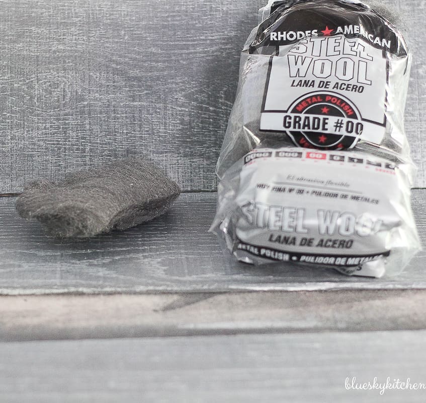 How to Create a Weathered Wood Backsplash. Palette in a Box and Amy Howard at Home products created a weathered looking wall as a backsplash.