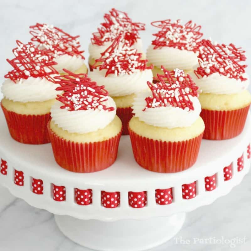 Valentine cupcakes with white icing and red sprinkles