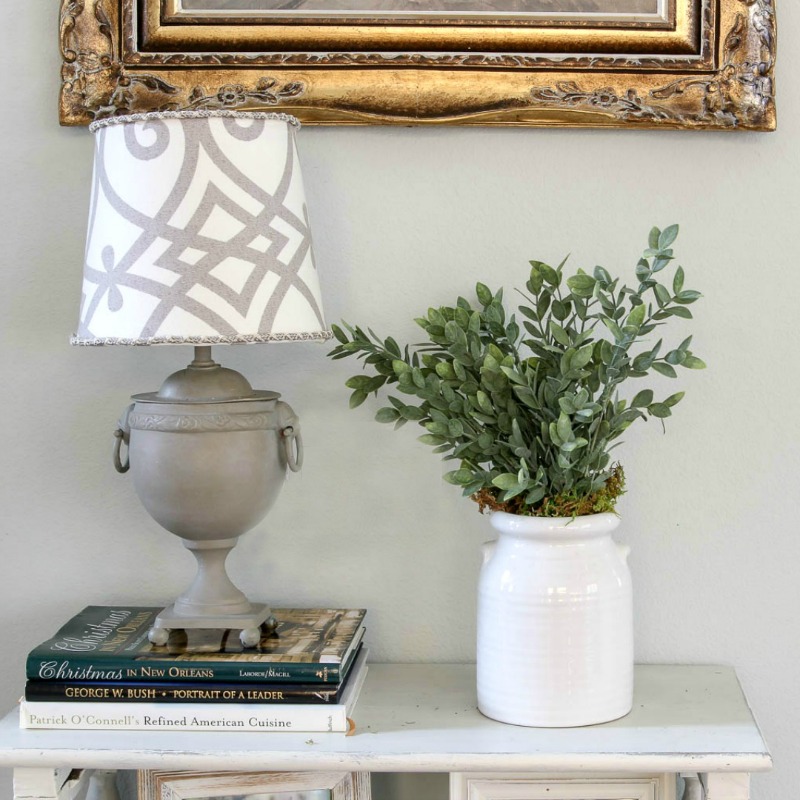 grey lamp with pattern lamp shade with faux greenery
