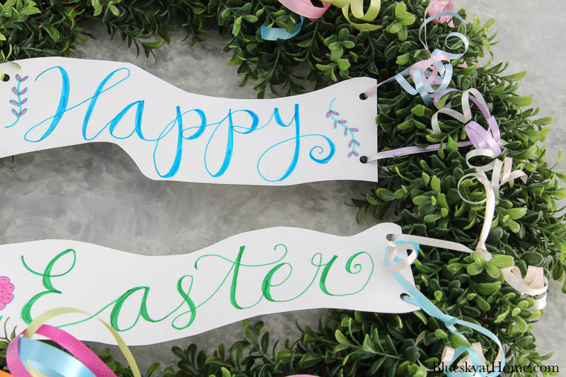 Happy Easter sign tied to wreath