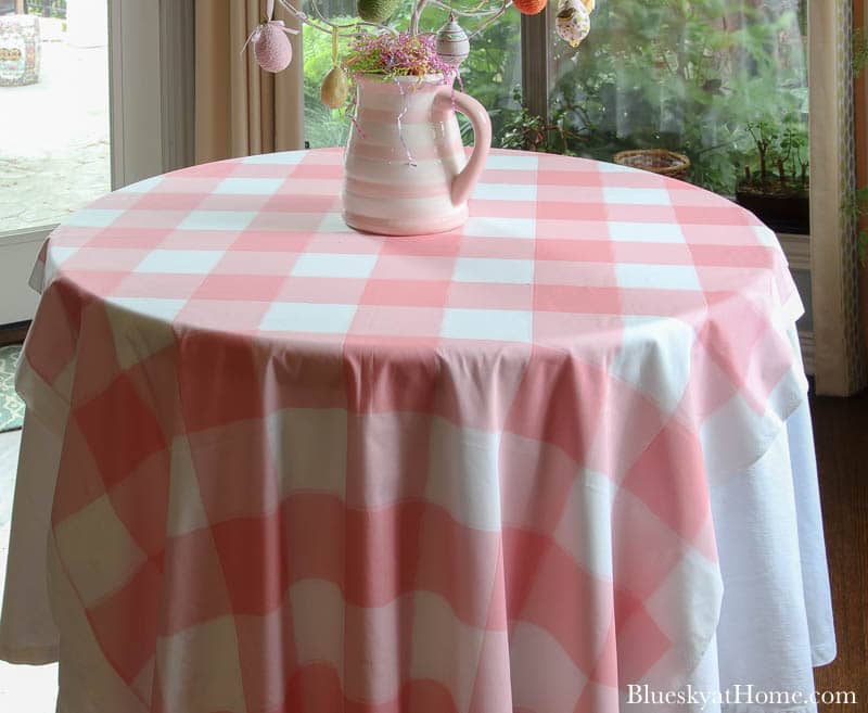 pink check tablecloth with pink and white pitcher