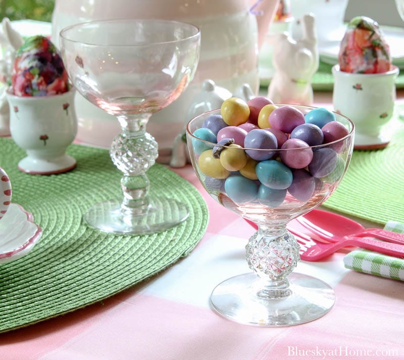 pastel candies in pink glass