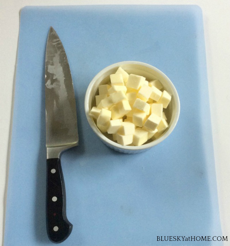 diced butter and knife