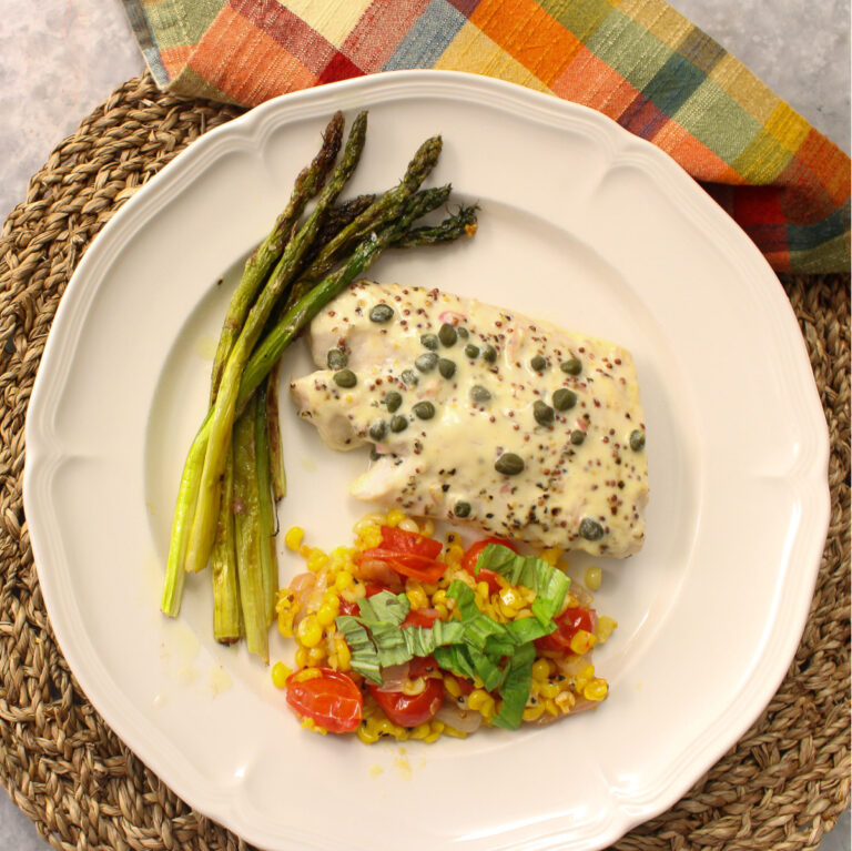 mustard-roasted fish on plate with vegetables