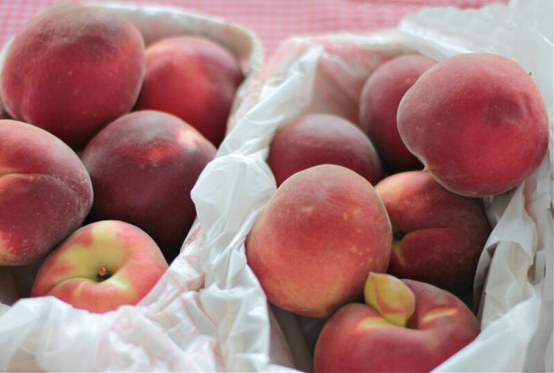 fresh peaches in baskets