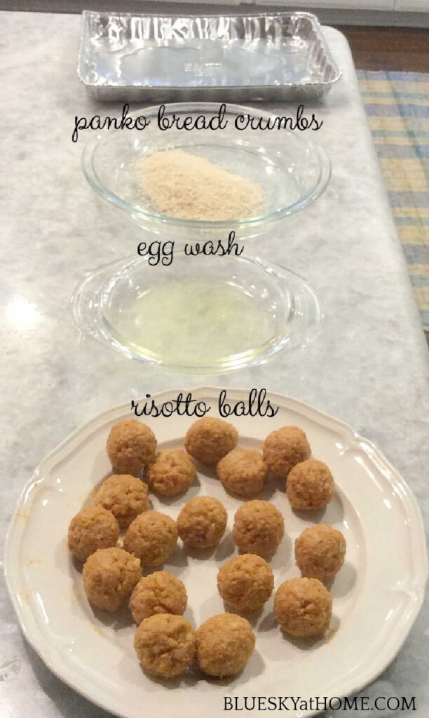 bowls of egg wash, panko bread crumbs and pumpkin risotto balls