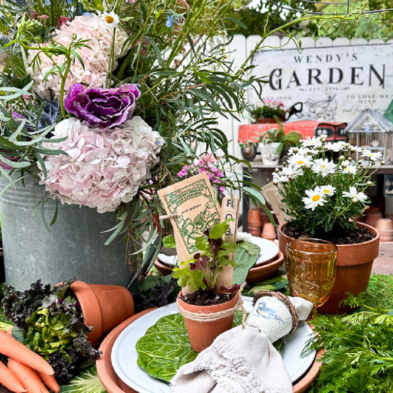 vignette of garden flowers in various containers