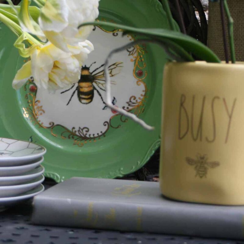 bee plate in a May vignette