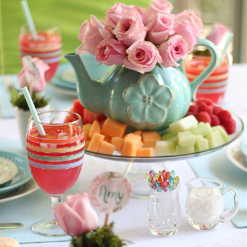 May tablescape in pastels with pink roses in teapot