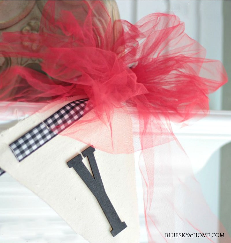 letter Y with red ribbon