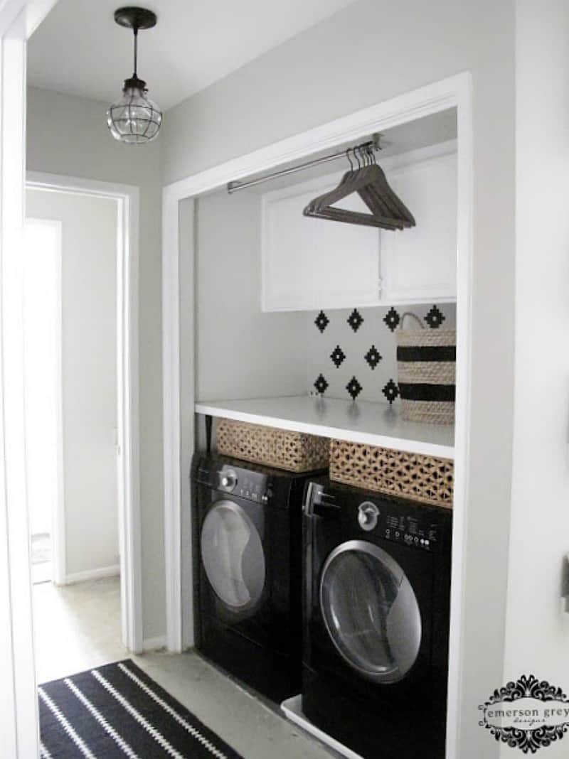 laundry room in closet with counter and cabinets