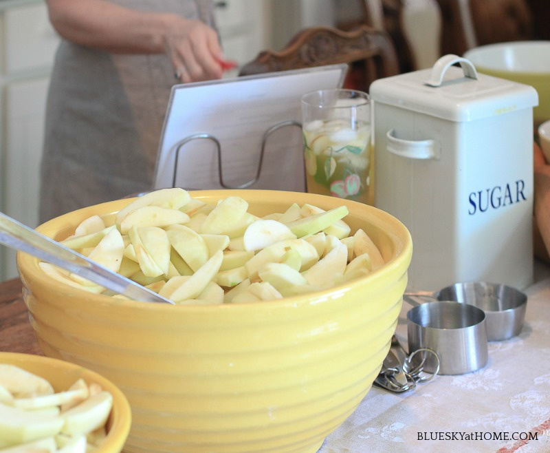 yellow bowl of sliced apples