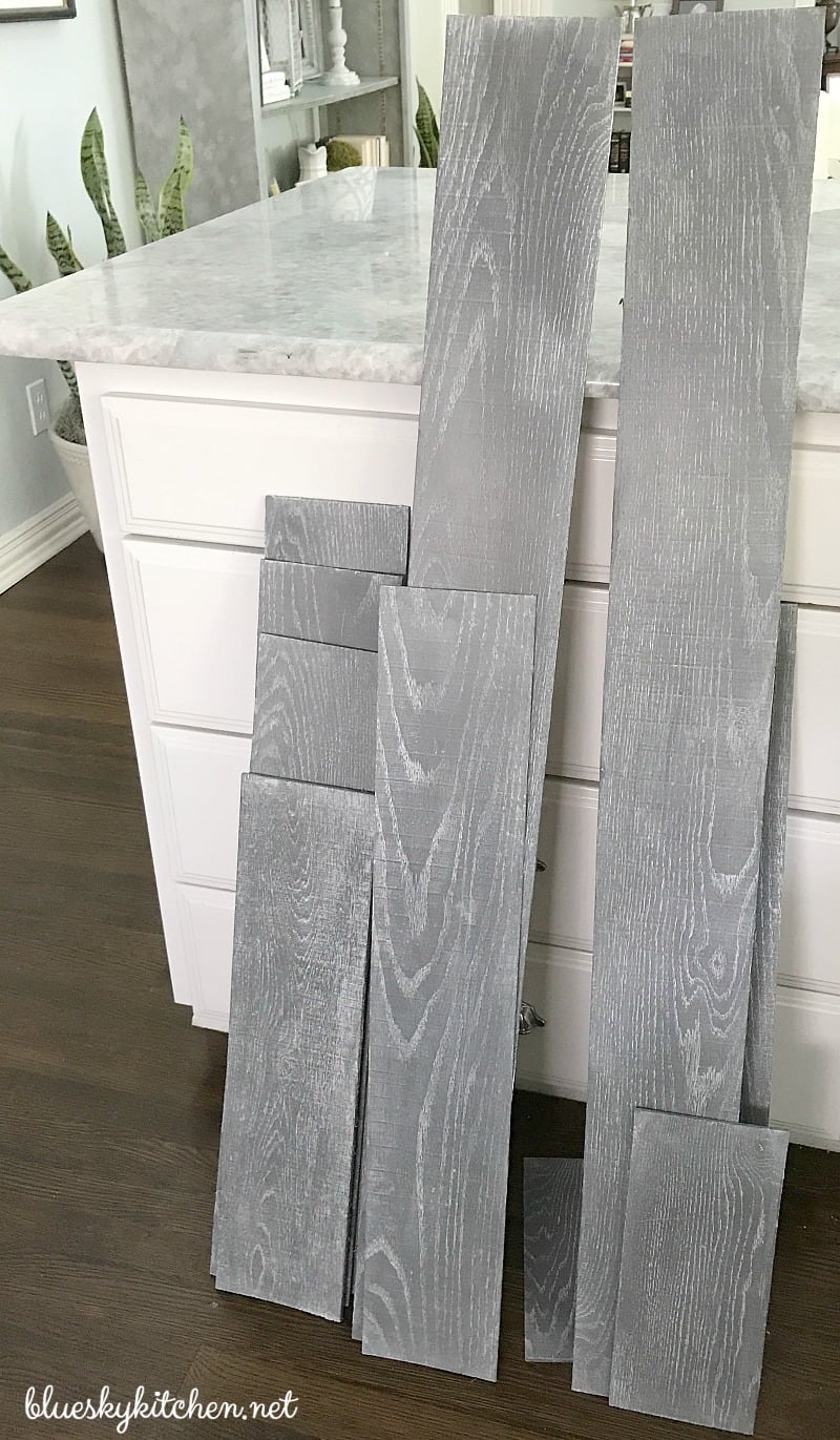 How to Create a Weathered Wood Backsplash. Palette in a Box and Amy Howard at Home products created a weathered looking wall as a backsplash.