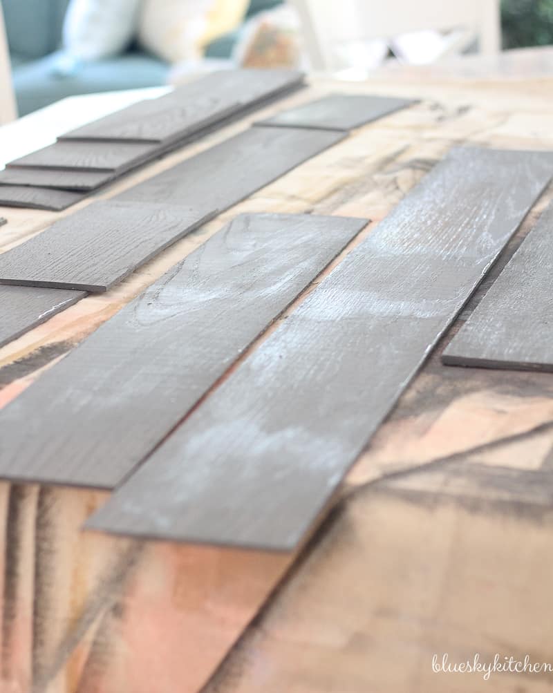 How to Create a Weathered Wood Backsplash. Palette Wall in a Box and Amy Howard at Home products created a weathered looking wall as a backsplash.