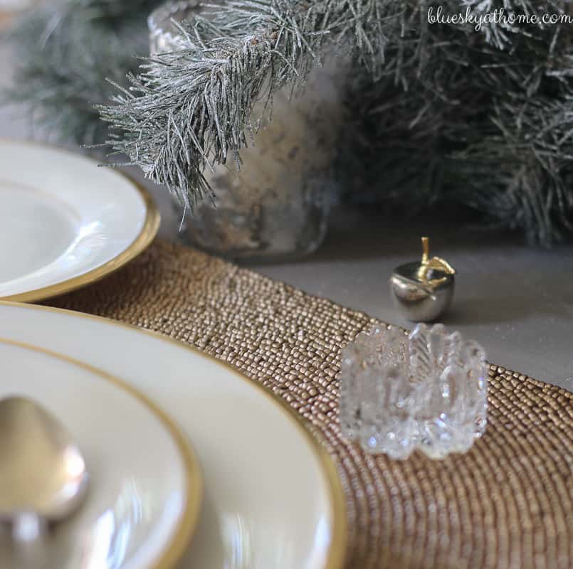 Santas and Reindeer Shine in Christmas Tablescape 2017. Green, gold, silver and white create a soft silhouette for holiday characters. BlueskyatHome.com