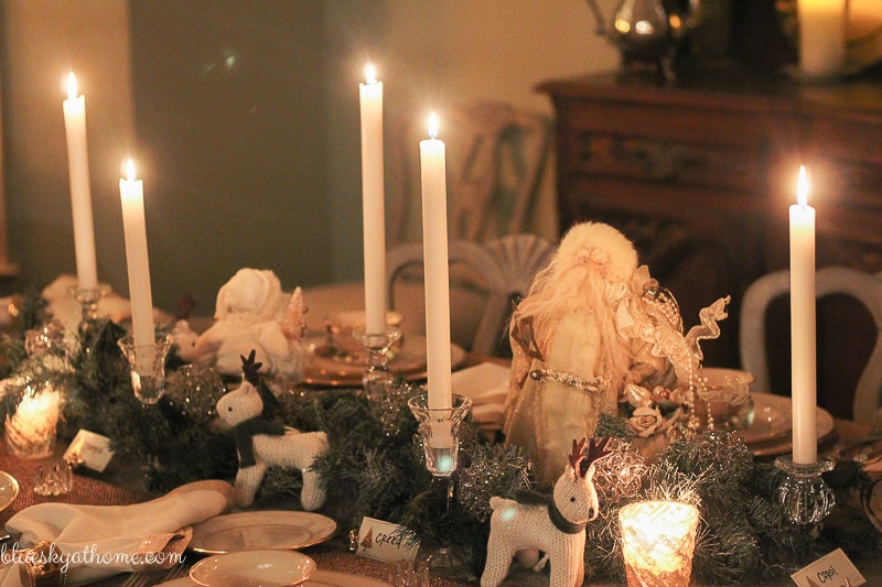 Santas and Reindeer Shine in Christmas Tablescape 2017. Green, gold, silver and white create a soft silhouette for holiday characters. BlueskyatHome.com