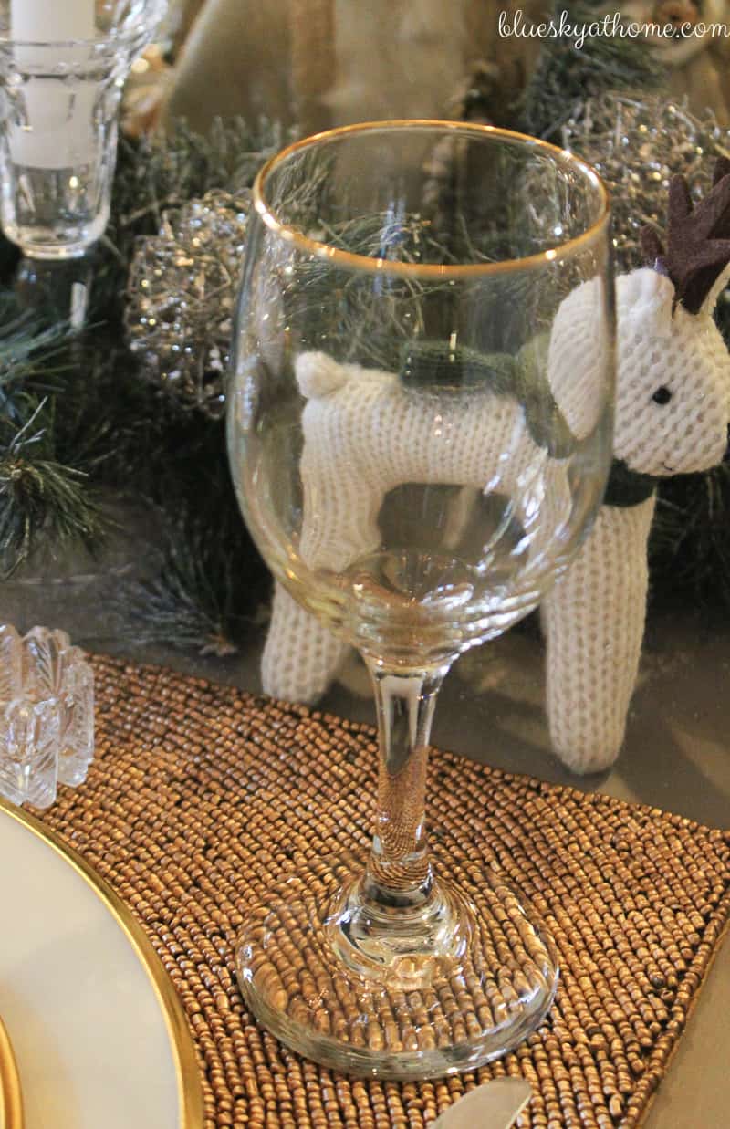 Santas and Reindeer Shine in Christmas Tablescape 2017. Green, gold, silver and white create a soft silhouette for holiday characters. BlueskyatHome.com