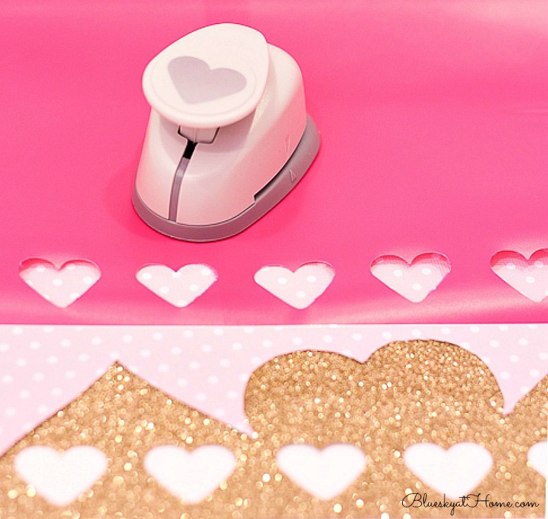 punching out pink and gold hearts