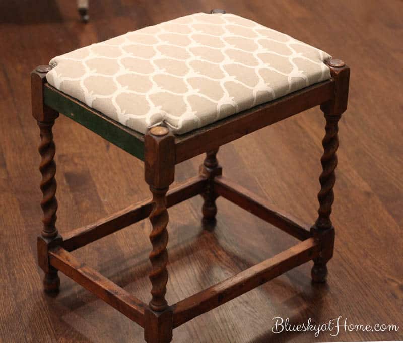 How to Repurpose a Vintage Stool ~ from Wobbly to Wow. Don't give up on that old vintage piece. Our little stool gets a new life with wood glue, wood corners and a new pretty fabric seat. BlueskyatHome.com