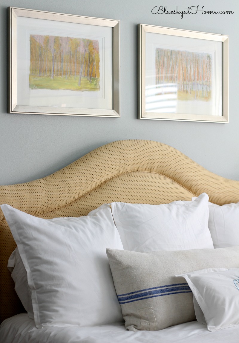 master bed with wall art