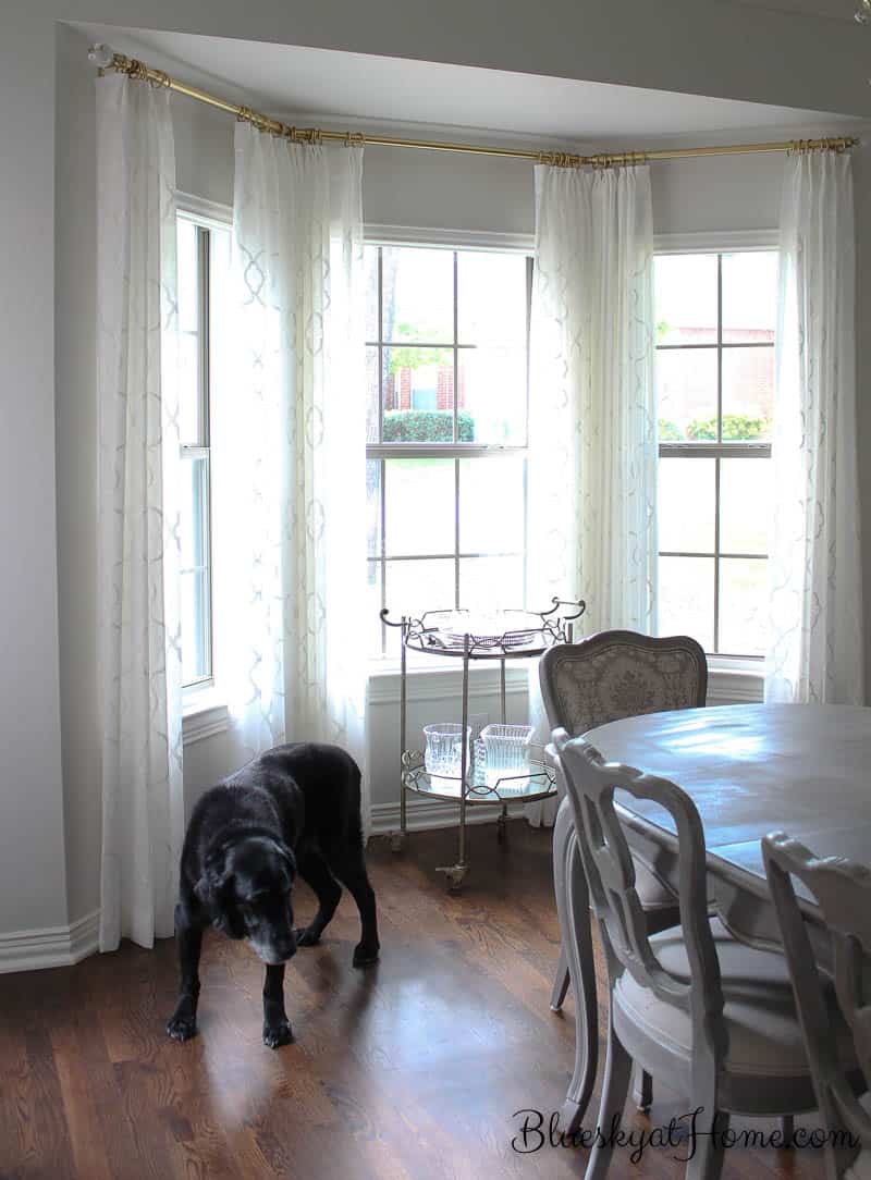Amazing Accessories for a Dining Room Makeover ~ ORC Week 5. See how art gives life and color to any space, but especially this updated dining room. Drapes create a fresh look for a bay window. BlueskyatHome.com
