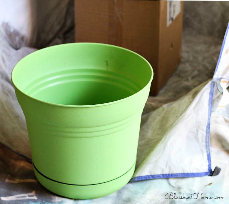 painting green plastic planter