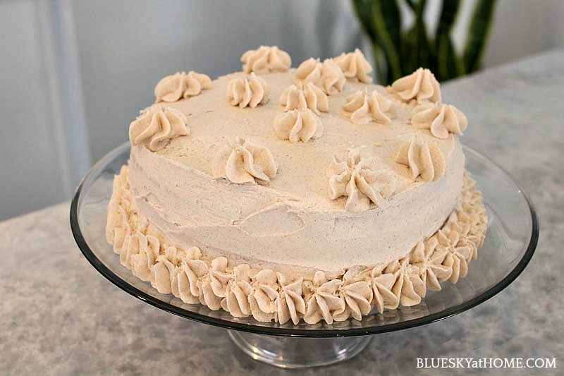 cinnamon cake with pipe frosting