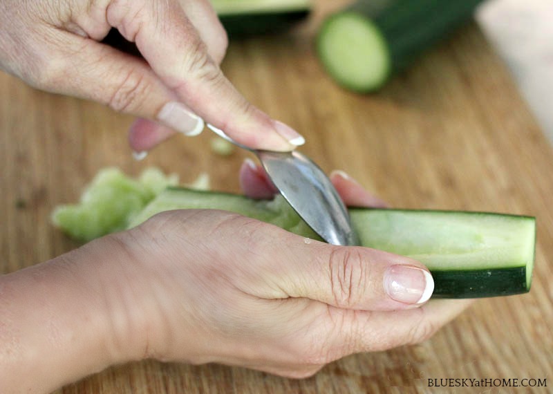 removing seeds from cucumber for making Cucumber Tomatillo Gazpacho