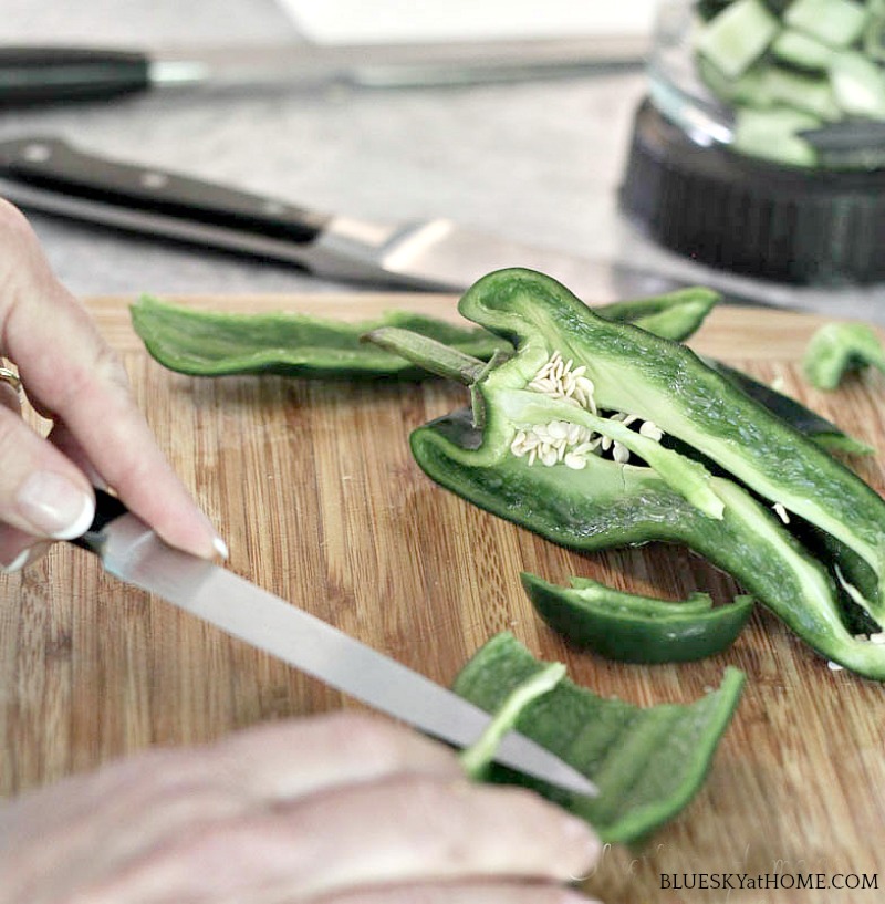 slicing poblano pepper for making Cucumber Tomatillo Gazpacho 