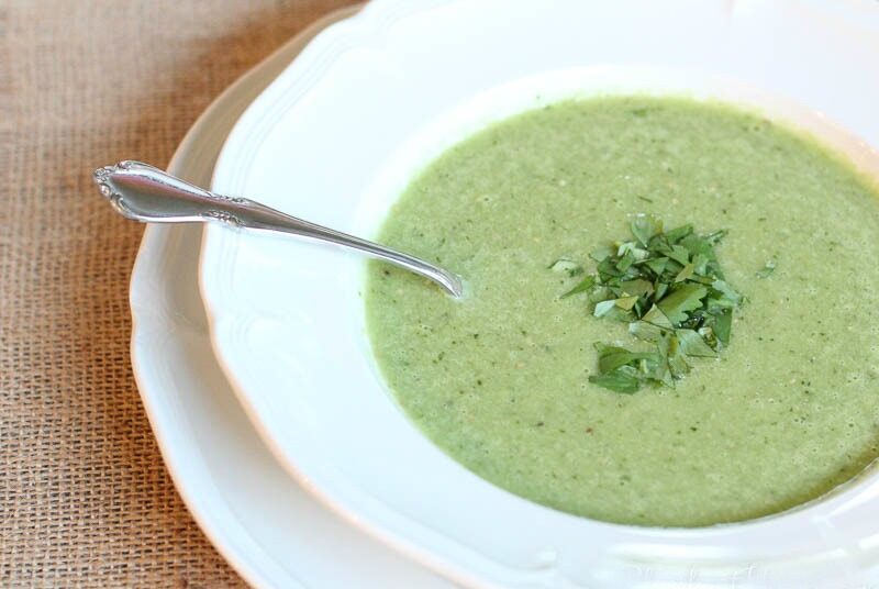 Cucumber Tomatillo Gazpacho Soup in white bowl with spoon
