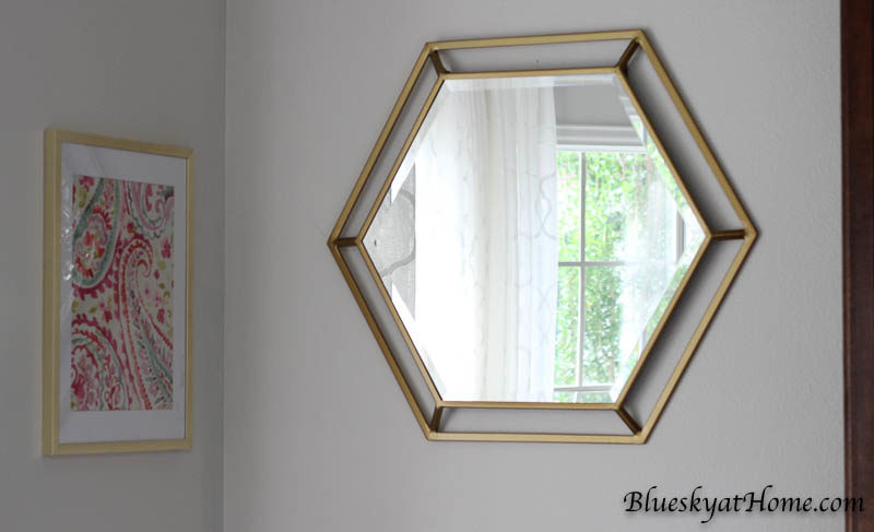 How to Hang Mirrors without Losing Your Mind. An easy way to hang mirrors or art with double hangers. BlueskyatHome.com #mirrors #art #hangingmirrors