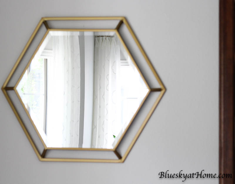 How to Hang Mirrors without Losing Your Mind. An easy way to hang mirrors or art with double hangers. BlueskyatHome.com #mirrors #art #hangingmirrors