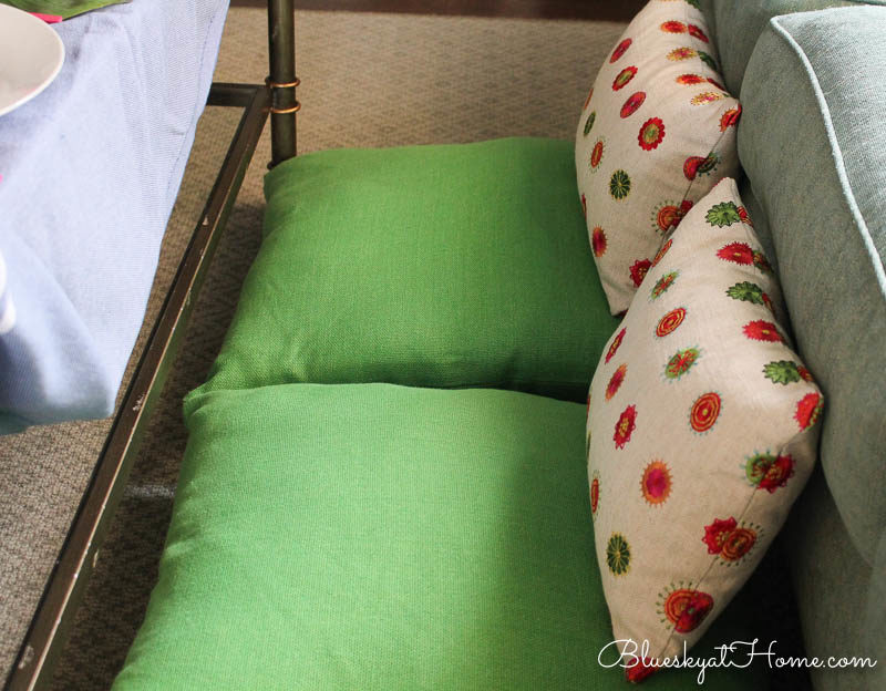 green pillows and patterned pillows