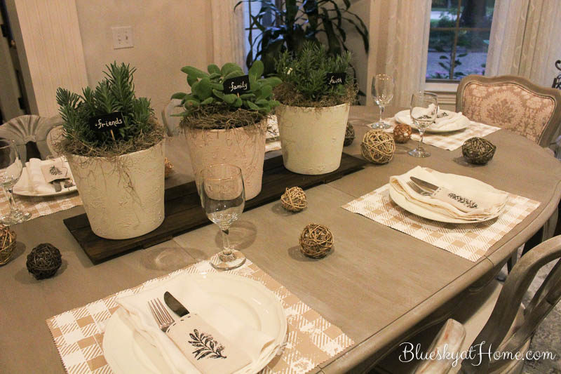 fall planters with herbs on table