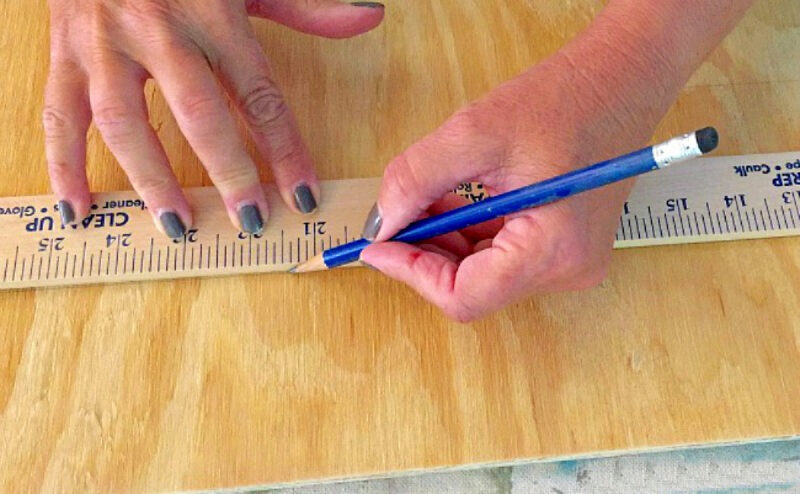 measuring plywood to paint