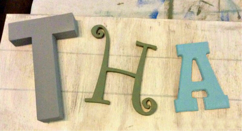 wood letters on piece of plywood