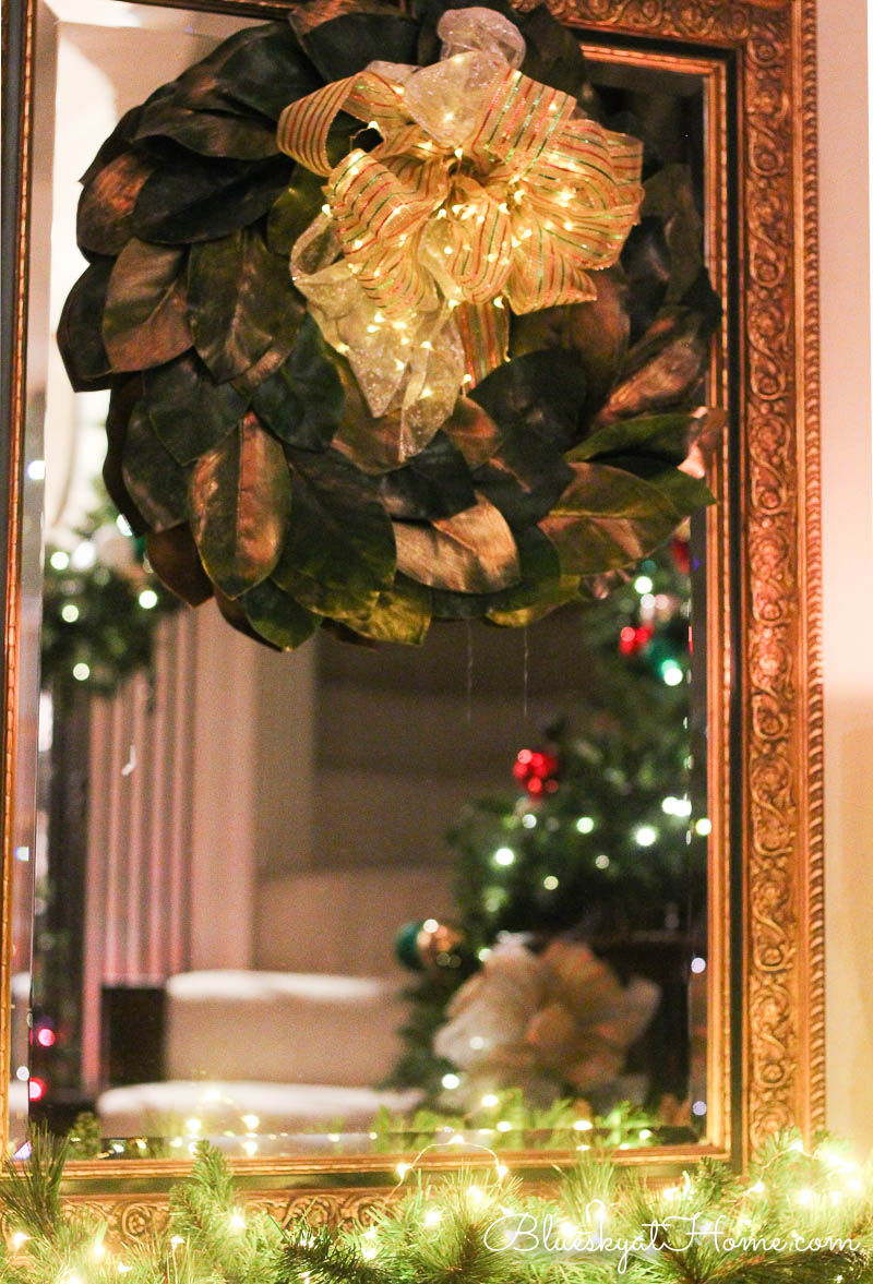 Christmas vignette in the entry with liglhts