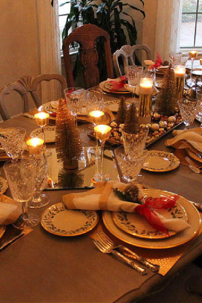 lighted red and gold Christmas table setting