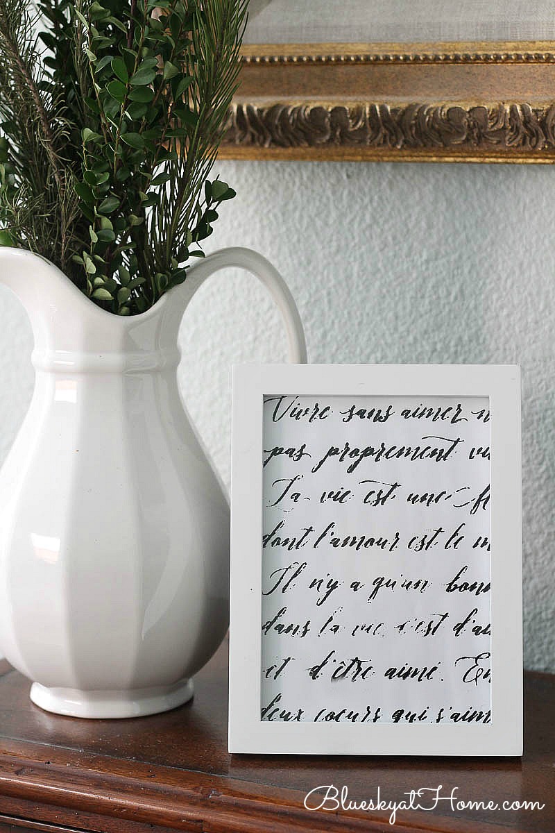 White vase and stenciled frame