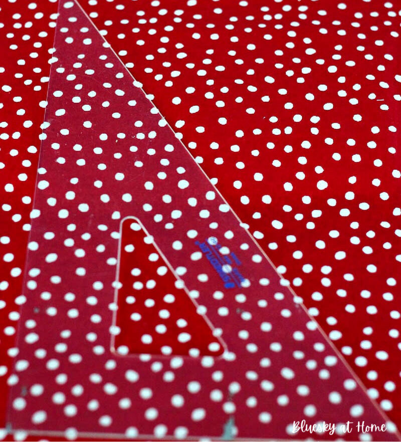 red polka-dot fabric with straight edge