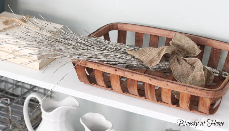 winter decor twigs in wood baskets