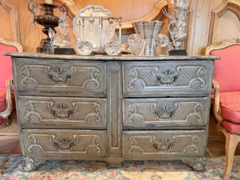grey dresser with decorative accessories.