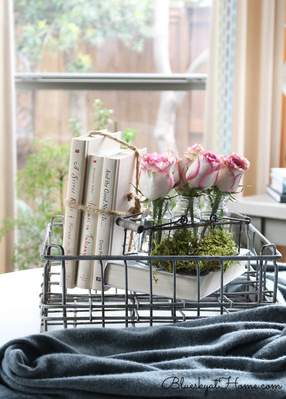 wire basket, roses, books
