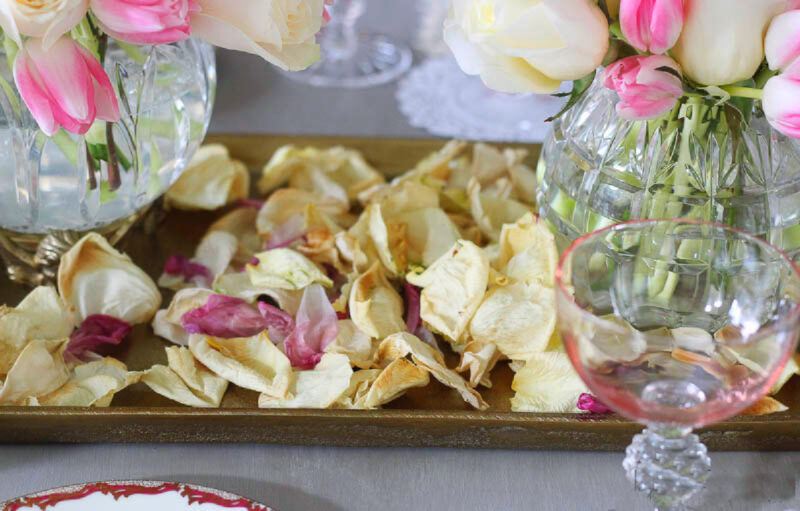 rose petals on vintage ladies tablescape