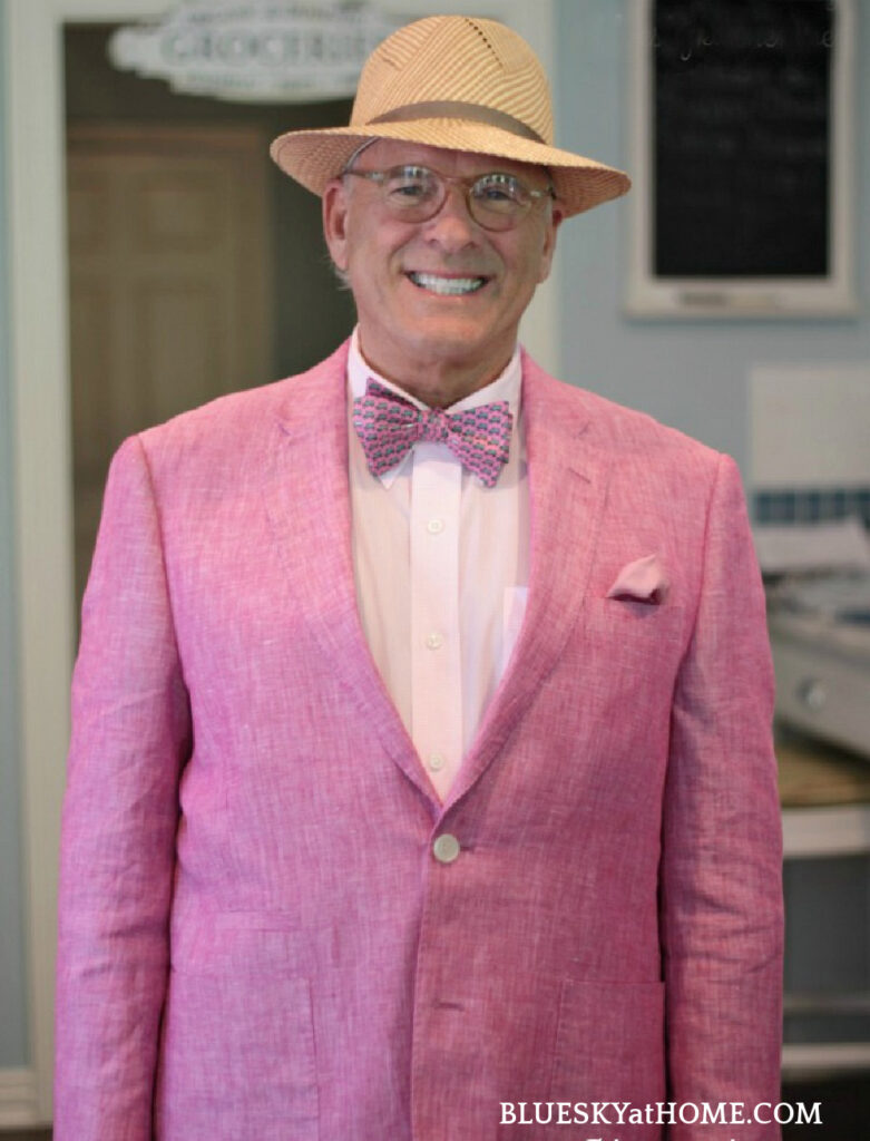 man in pink sport coat and hat
