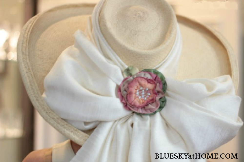 beige hat with white bow