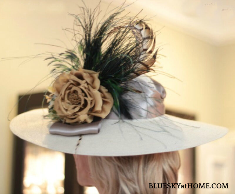 white Kentucky Derby hat with flower adn feathers